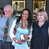Ebony Miles (center) won a $2,500 piece of jewelry designed by John Pereira.